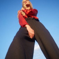 portrait of beautiful young woman dancing in a meadow - fashion stock pictures, royalty-free photos & images