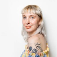 portrait of blond woman with shoulder tattoo - hairstyle stock pictures, royalty-free photos & images