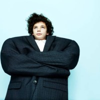 portrait of boy wearing big coat - fashion stock pictures, royalty-free photos & images