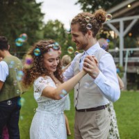 portrait of bride and groom dancing at small garden wedding. - garden decoration stock pictures, royalty-free photos & images