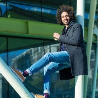 portrait of cheerful handsome man in casual wear posing for the camera bearded young man - junk food stock pictures, royalty-free photos & images