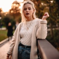 portrait of confident young woman standing in park during autumn - fashion stock pictures, royalty-free photos & images