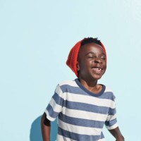 portrait of cool boy laughing , on studio background - fashion stock pictures, royalty-free photos & images