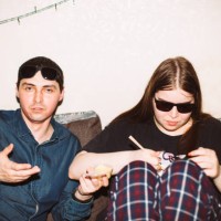 portrait of friends sitting on the sofa during house party - junk food stock pictures, royalty-free photos & images