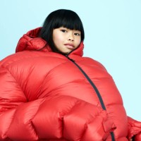 portrait of girl wearing huge coat - fashion stock pictures, royalty-free photos & images