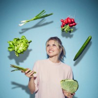 portrait of happy young woman juggling with vegetables - food stock pictures, royalty-free photos & images