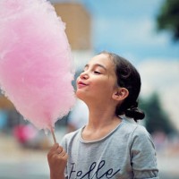 portrait of little girl eating cotton candy - food stock pictures, royalty-free photos & images