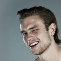 portrait of man winking - hairstyle stockfoto's en -beelden