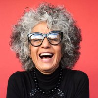 portrait of mature woman laughing - hairstyle stock-fotos und bilder