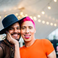 portrait of mid adult gay couple on a festival - concert stock pictures, royalty-free photos & images