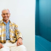 portrait of mixed race man with street style sit on wheelchair at white background - fashion stock pictures, royalty-free photos & images