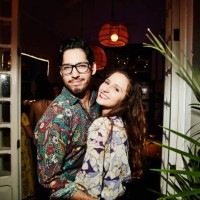 portrait of smiling embracing couple on date in night club - fashion stock pictures, royalty-free photos & images