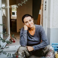portrait of smiling female carpenter sitting at entrance of house - home decoration stock pictures, royalty-free photos & images