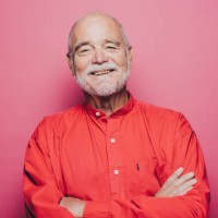 portrait of smiling senior man with arms crossed against pink background - fashion stock pictures, royalty-free photos & images
