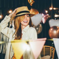 portrait of smiling woman at backyard party on summer evening - garden decoration stock pictures, royalty-free photos & images
