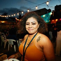 portrait of smiling woman in backyard during party with friends on summer evening - garden decoration stock pictures, royalty-free photos & images