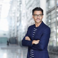 portrait of stylish businessman with stubble wearing blue suit and glasses - fashion stock pictures, royalty-free photos & images