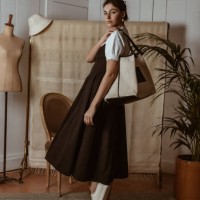 portrait of stylish young woman at home with reusable bag,houseplant and mannequin,avignon,france - fashion stock pictures, royalty-free photos & images