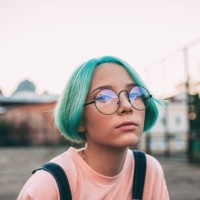 portrait of teenage girl with green dyed hair wearing eyeglasses - fashion stock pictures, royalty-free photos & images