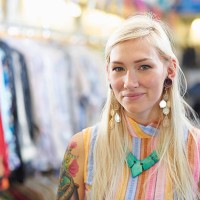 portrait of vintage clothes shop owner. - fashion stock pictures, royalty-free photos & images