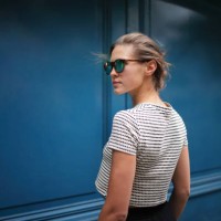 portrait of woman against blue wall - fashion stock pictures, royalty-free photos & images