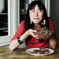 portrait of woman eating chocolate cake - junk food stock pictures, royalty-free photos & images