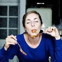 portrait of woman eating spaghetti - food stock pictures, royalty-free photos & images