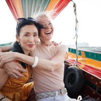 portrait of woman sitting with friend in boat - travel stock pictures, royalty-free photos & images