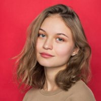 portrait of woman with light brown hair and smiling against red background - hairstyle stock pictures, royalty-free photos & images