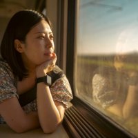 portrait of young female tourist traveling by train - travel stock pictures, royalty-free photos & images