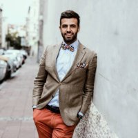 portrait of young handsome fashion blogger leaned on the wall. - hairstyle stock pictures, royalty-free photos & images