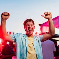 portrait of young man dancing on party outdoors - concert stock pictures, royalty-free photos & images