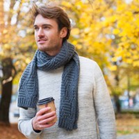 portrait of young man with coffee to go in autumn - junk food stock pictures, royalty-free photos & images