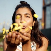 portrait of young woman blowing kiss of flowers - fashion stock pictures, royalty-free photos & images