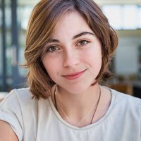 portrait of young woman in cafe, smiling - hairstyle stock-fotos und bilder