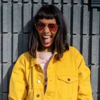 portrait of young woman, wearing yellow jeans jacket - fashion stock pictures, royalty-free photos & images