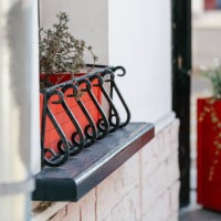 potted plants as the outdoors window decoration - garden decoration stock pictures, royalty-free photos & images