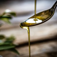 pouring extra virgin olive oil - food stock pictures, royalty-free photos & images