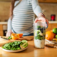 pregnant woman making healthy smoothie - food stock pictures, royalty-free photos & images