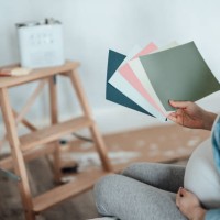 pregnant woman renovating nursery room for her newborn baby - home decoration stock pictures, royalty-free photos & images