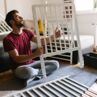 preparing the crib for new family member - home decoration stock pictures, royalty-free photos & images