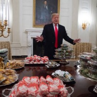 President Donald Trump speaks alongside fast food he purchased for a ceremony honoring the 2018 College Football Playoff National Champion Clemson...