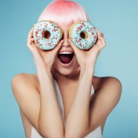 pretty blonde with multi-colored donuts - fashion stock pictures, royalty-free photos & images