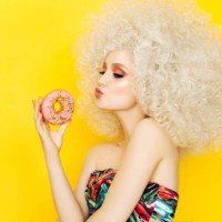 pretty blonde with pink donuts - fashion stock pictures, royalty-free photos & images