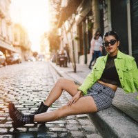 pretty girl sitting in the street - fashion stock pictures, royalty-free photos & images