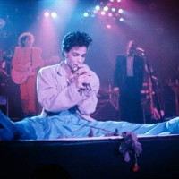 Prince performs on stage on the Hit N Run-Parade Tour, Wembley Arena, London, August 1986.