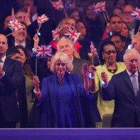 Prince William, Prince of Wales, Queen Camilla and King Charles III in the Royal Box at the Coronation Concert in the grounds of Windsor Castle on...