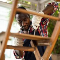 professional carpenter assembling wooden adirondack chair with screwdriver. manual work - home decoration stock pictures, royalty-free photos & images