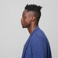 profile of young businessman in blue blazer - hairstyle stock pictures, royalty-free photos & images