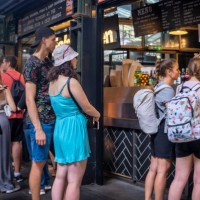 queuing for fish and chips at a stall in borough market - junk food stock pictures, royalty-free photos & images